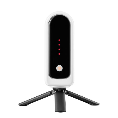 Black and white electronic device on a tripod with red indicator lights on a white background