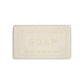 A rectangular bar of soap with embossed text reading 'PURE VEGETABLE SOAP MADE IN ENGLAND' 