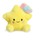 Yellow plush star toy with a rainbow on top against a white background