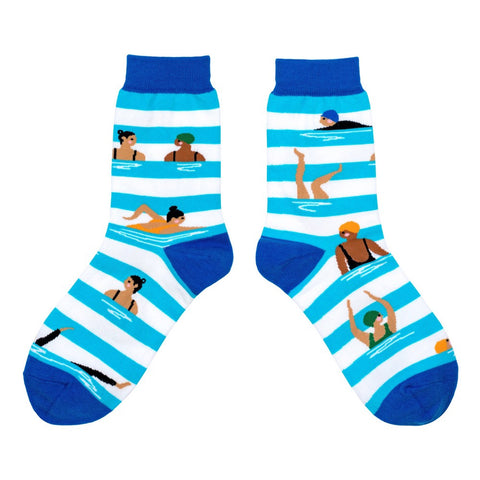 Pair of socks with blue and white stripes and illustrations of people in swimsuits on 