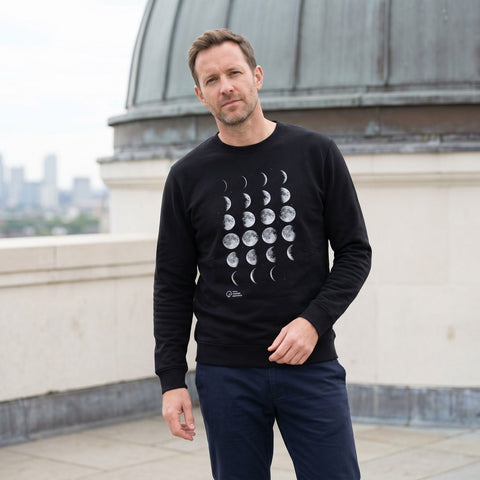 man wearing black moon phase sweatshirt