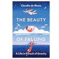 Book cover of 'The Beauty of Falling' by Claudia de Rham with illustrations of a person diving and an astronaut.