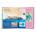 Open book with educational content about the Suez and Panama Canals