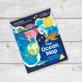 Children's book titled 'The Ocean Map' on a wooden surface