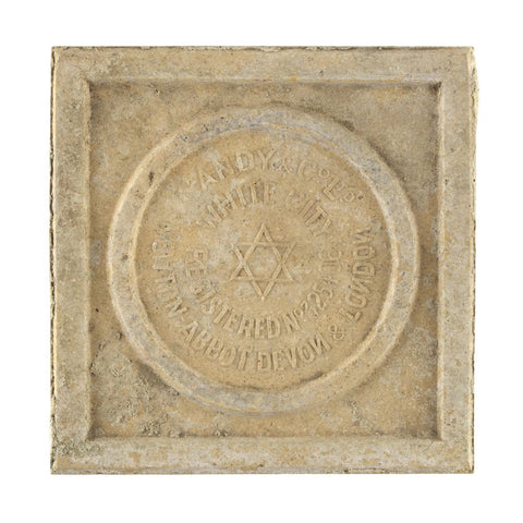 Decorative stone tile with a star of David and text