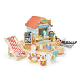 Toy set with a fish and chip shop, deck chair, and penguin figures