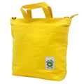 Yellow tote bag with a visible brand logo 