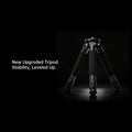 A black tripod photographed on a black studio background with white text on the left reading 'New Upgraded Tripod. Stability, Leveled Up.