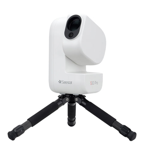 A Seestar S50 Pro white and black telescope on a black tripod 