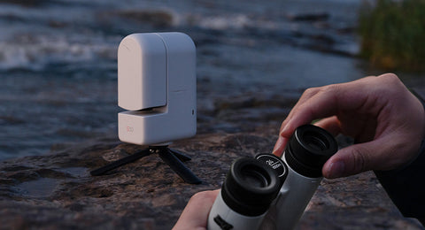 ZWO Seestar Binoculars next to ZWO Seestar S30 All-in-One Smart APO Telescope & Tripod in an outdoor setting
