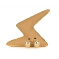A gold metallic lightning-bolt-shaped plush toy with a smiling face and small metallic feet