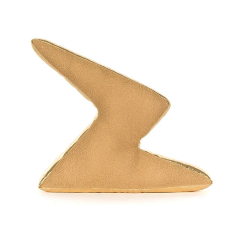 A gold lightning bolt-shaped plush toy with a matte textured finish
