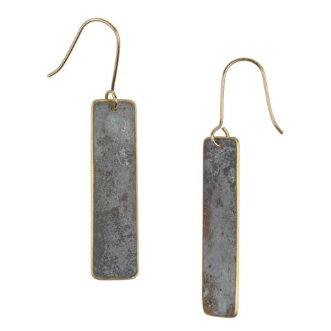 Two tarnished brass earrings with gold wire hooks.