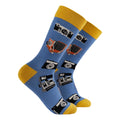 A pair of crew socks in light blue with yellow cuffs, heels, and toes, decorated with a pattern of vintage film cameras and slide photographs.