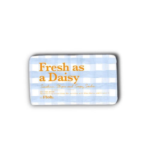 Soap bar with 'Fresh as a Daisy' text on a blue and white checkered background