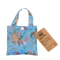 Recycled shopping bag with turtle and coral design on a blue background, featuring an eco-friendly tag.