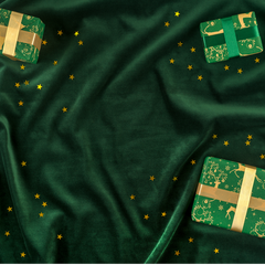 Christmas gift guide green and gold parcels on a green background