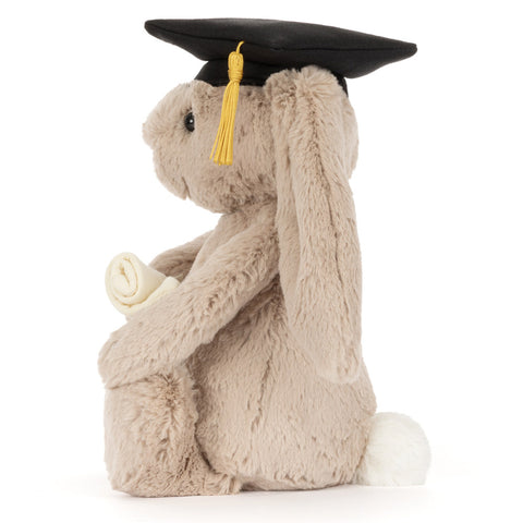 Plush bunny toy wearing a graduation cap and holding a degree scroll, side view