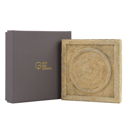 Square stone tile with engraved design and 'Cuty Sark Greenwich' branding on a grey box.