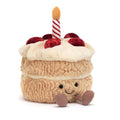 Plush toy cake with a candle on 
