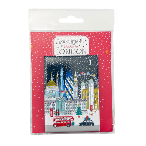 Packaged fridge magnet with a snowy London skyline illustration on a red background
