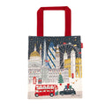 Tote bag with London-themed design featuring iconic buildings and a red bus.
