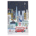 A cotton teatowel featuring a stylized London night scene with snow falling. The artwork includes the London Eye, Big Ben, Shard, Westminster Abbey, a red double-decker bus, a black cab, a red telephone booth, and a Christmas tree.