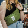 A model wearing Cora + Spink bum bag