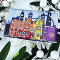 Bar of soap with a colorful cityscape design wrapper on a Christmas decorative background
