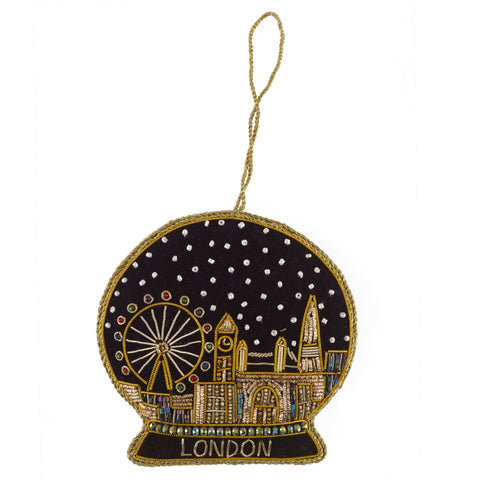 Decorative ornament shaped like a snow globe with London landmarks on a white background