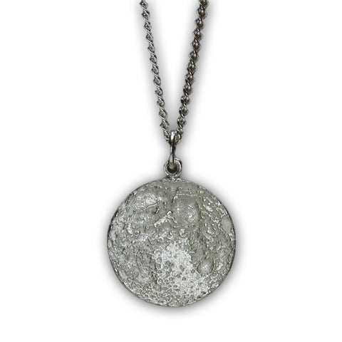 Silver necklace with textured pendant resembling the Moon.