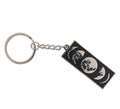 Rectangular silver and black keyring with moon phases design.