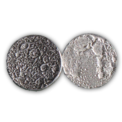 Round, textured silver earrings resembling the dark and light Moon.