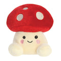 Red and white mushroom plush with a smiley face.