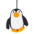 A felted wool penguin ornament hanging by a black string, featuring black wings and back, a white belly, a bright orange beak, and orange feet