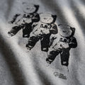 print of three astronauts on t-shirt