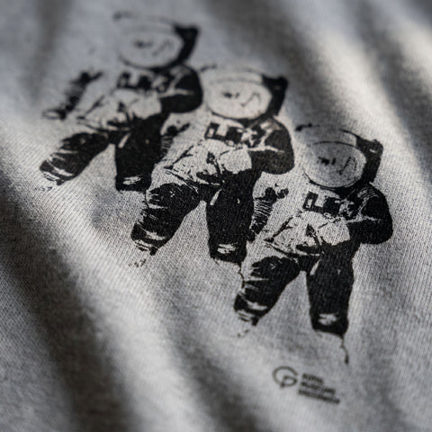 print of three astronauts on t-shirt