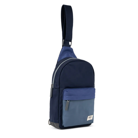 Navy and blue crossbody bag on a white background