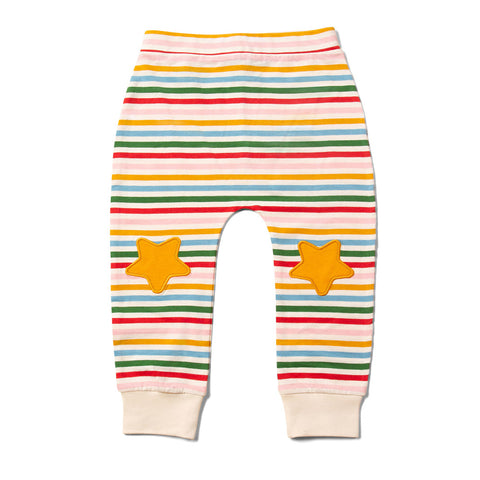 Kid's jogger trousers in red, yellow, green and blue stripes with yellow star patches on the knees