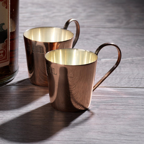 Copper rum measure cups.