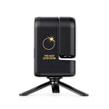 A black solar eclipse monitor smart telescope on a small tripod stand, featuring a gold sun and eclipse graphic with the text 'TOTAL SOLAR ECLIPSE EDITION' on the side.