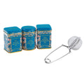 Three blue tea tins with floral designs and a metal tea infuser on a white background
