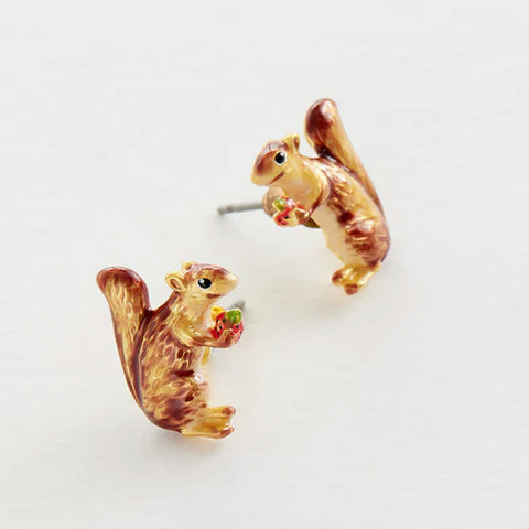 Two non-identical brown enamel squirrel-shaped earrings, each is holding a strawberry.