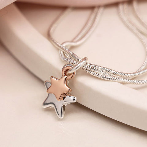 Silver and rose gold star charms.