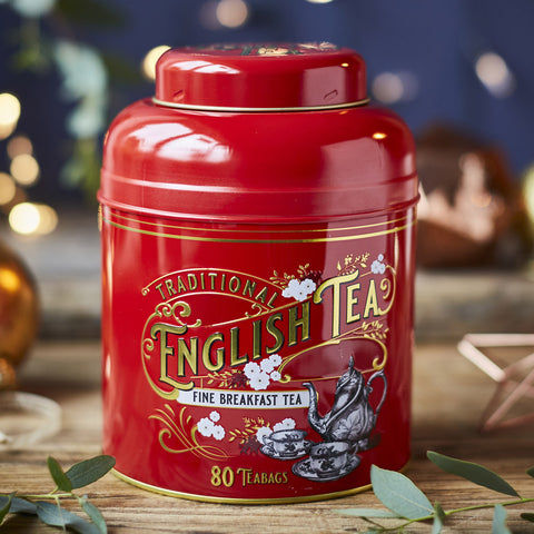 Red tea tin with vintage-style illustrated print.