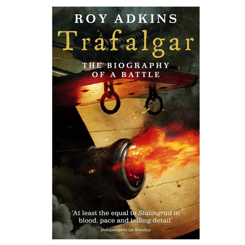 Book cover of 'Trafalgar: The Biography of a Battle' by Roy Adkins with a ship's cannon on fire.