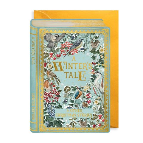 A hardcover book titled "A Winter's Tale" with ornate vintage-style bird and floral illustrations on the cover, shown in front of a mustard yellow envelope against a white background.