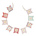 A Christmas letter banner garland spelling 'CHRISTMAS' made of red, white, and mint green pennants with striped and argyle patterns, hanging on a jute string.