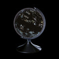 Black globe with colourful constellations on a silver stand.