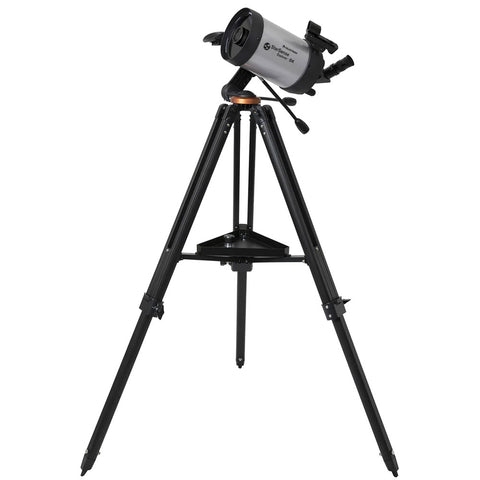 Silver and black telescope on a tripod.